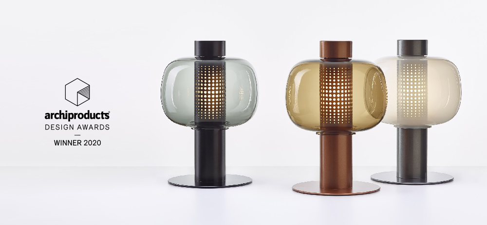 Three Brokis Bonbori table lamps with handblown tinted crystal shades, beside the Archiproducts Awards Winner 2020 logo.
