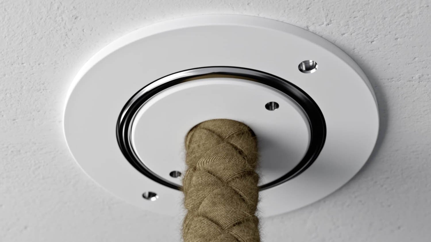 Close-up of a Brokis  Trimless ceiling connection rope anchored with three screws on a textured, white ceiling.