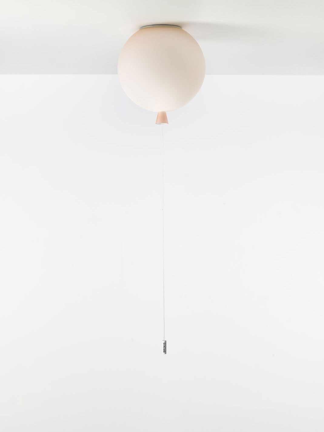 Brokis Memory Ceiling 250 in pale pink glass floats like a balloon, silver pull accentuating elegance.