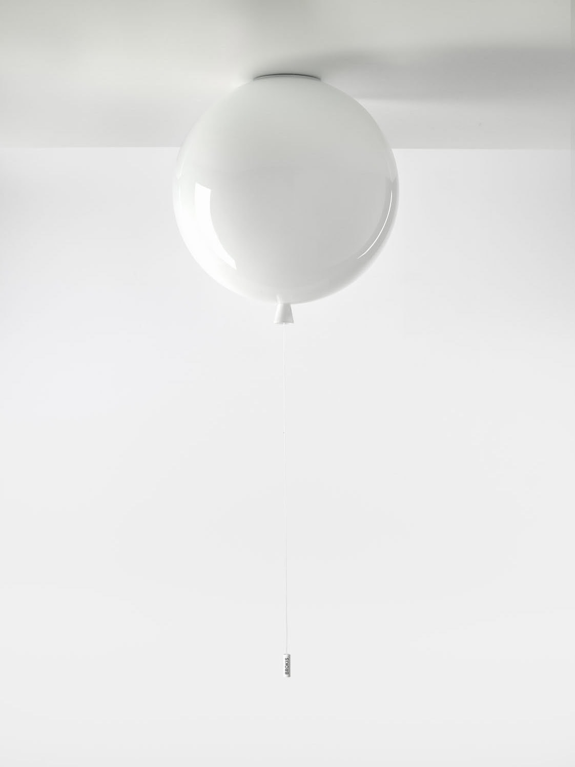 Memory Ceiling 400 by Brokis: a handblown, triplex opal sphere with metallic pull switch, floating against a white ceiling.