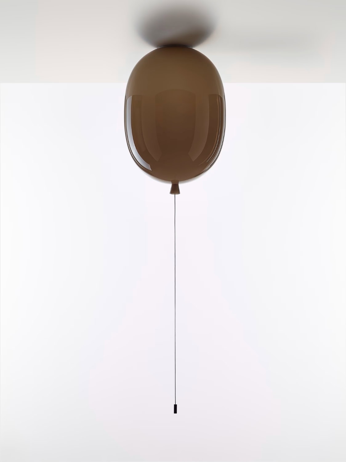 Brokis Memory Ceiling Oval 350 in brown glass is mounted, casting a luxe shadow on a pristine white ceiling.