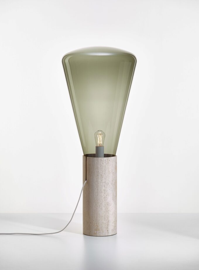 Brokis Muffins Wood 04 Floor lamp features a travertine base and hand-blown grey glass shade with exposed bulb.