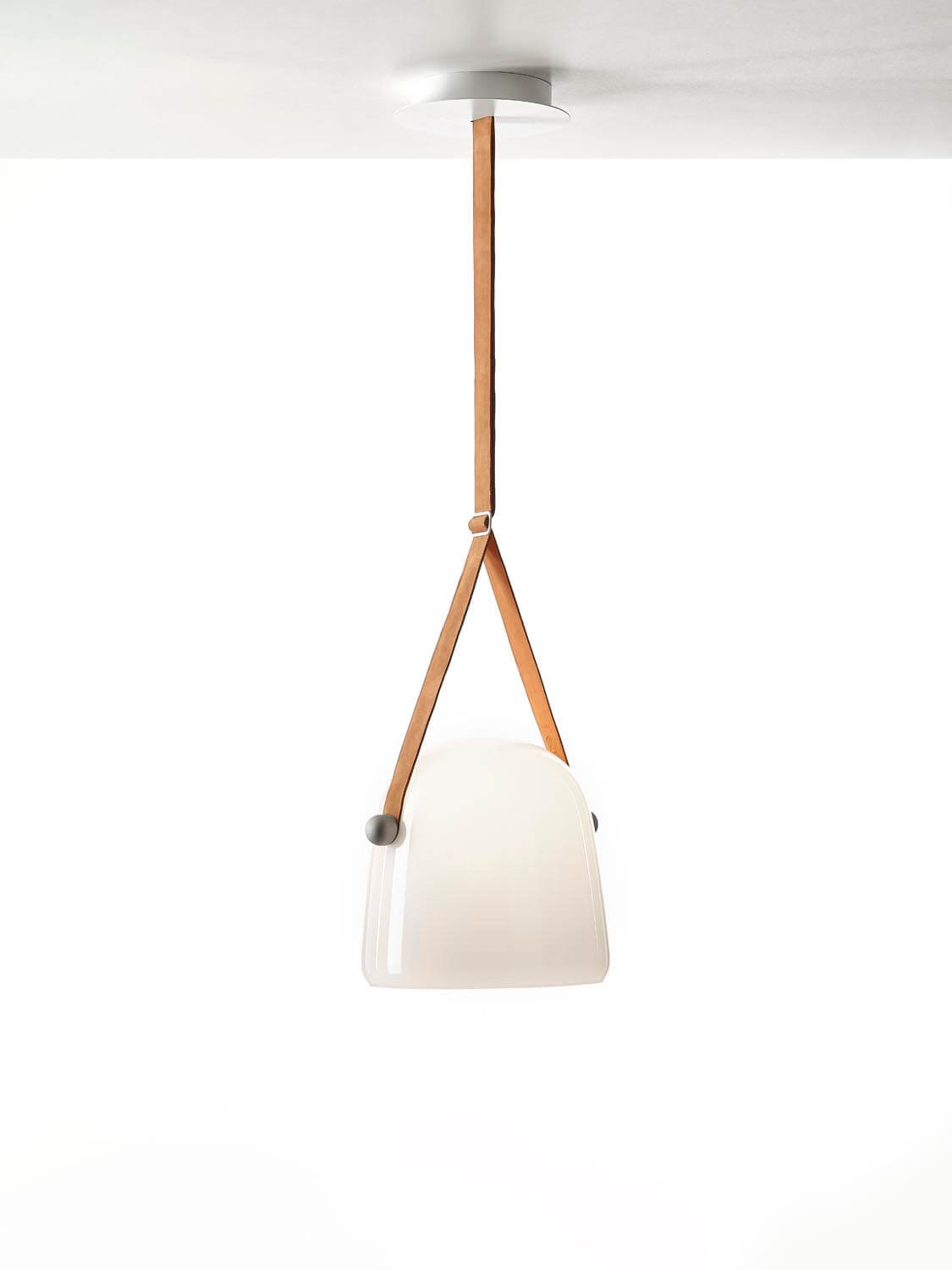 Brokis Mona Large Pendant exudes luxury with its handblown white glass shade and sculptural form, suspended by tan leather.