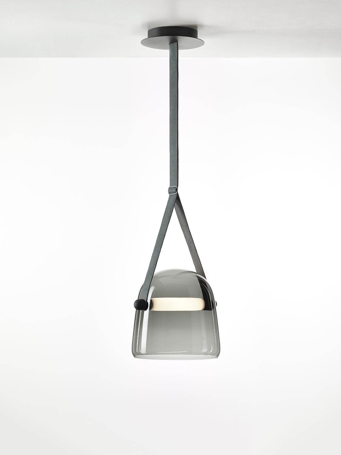 Mona Large Pendant by Brokis showcases handblown crystal glass and fabric straps, casting a luxe, diffused glow.