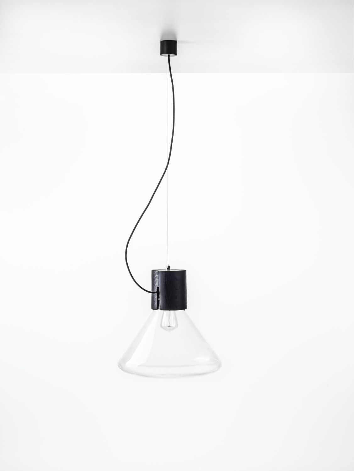 Brokis Muffins Wood 05 Pendant features handblown glass and a sculptural conical shade, luminous against white.