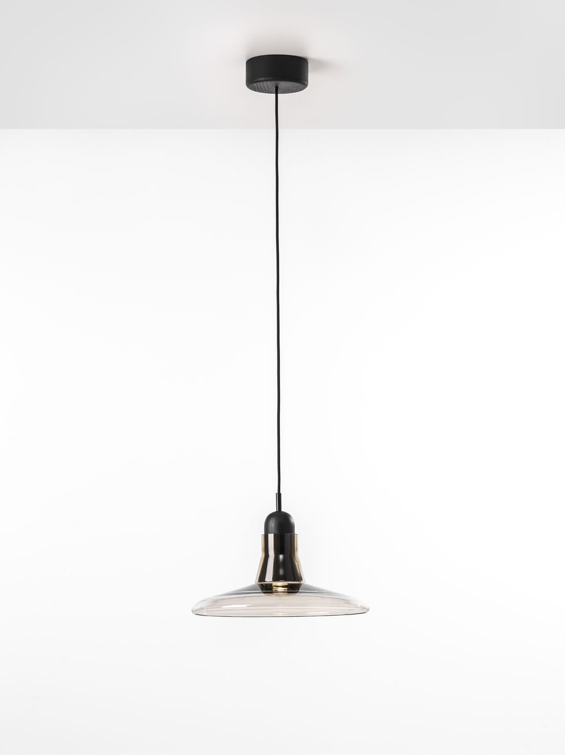 Shadows XL Large Pendant by Brokis features a sculptural clear glass shade and black accents, exuding refined minimalism.
