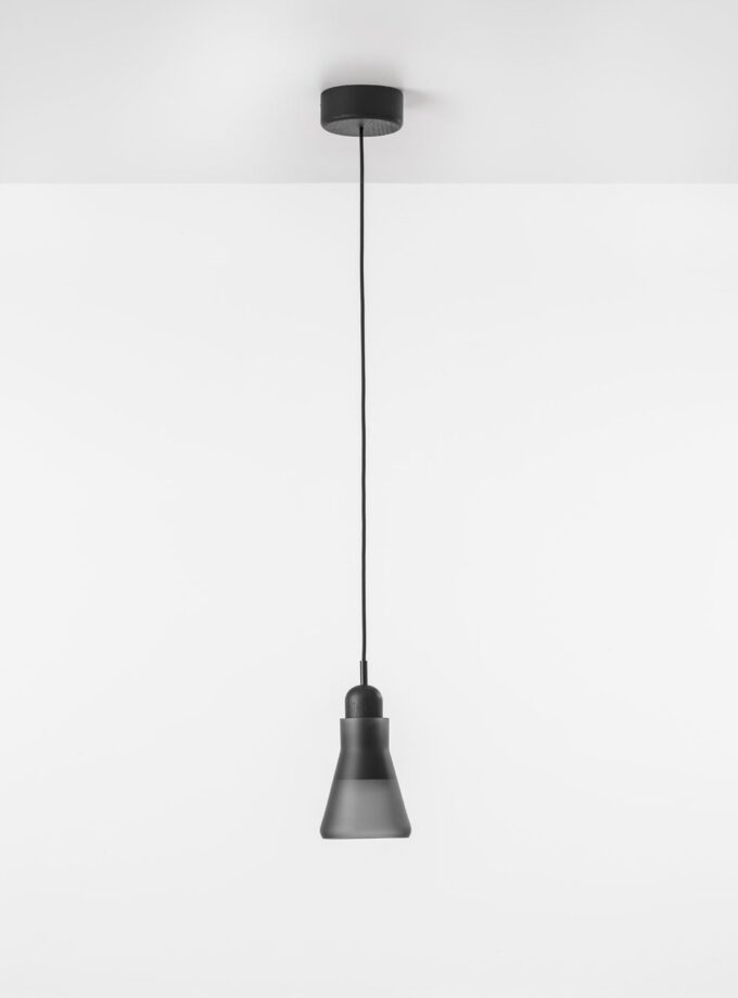 Brokis Shadows XL Narrow Pendant in smoke grey glass, its handblown conical form striking against a pristine white ceiling.