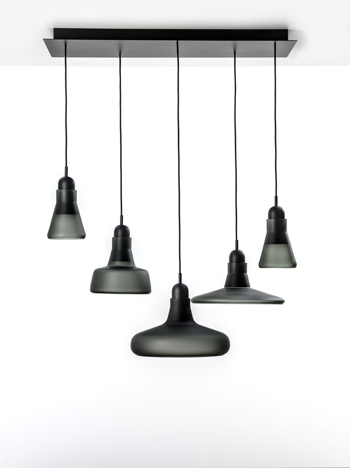 Brokis Shadows XL Set Rectangular Canopy Large with black glass shades in varied forms, suspended in sculptural elegance.