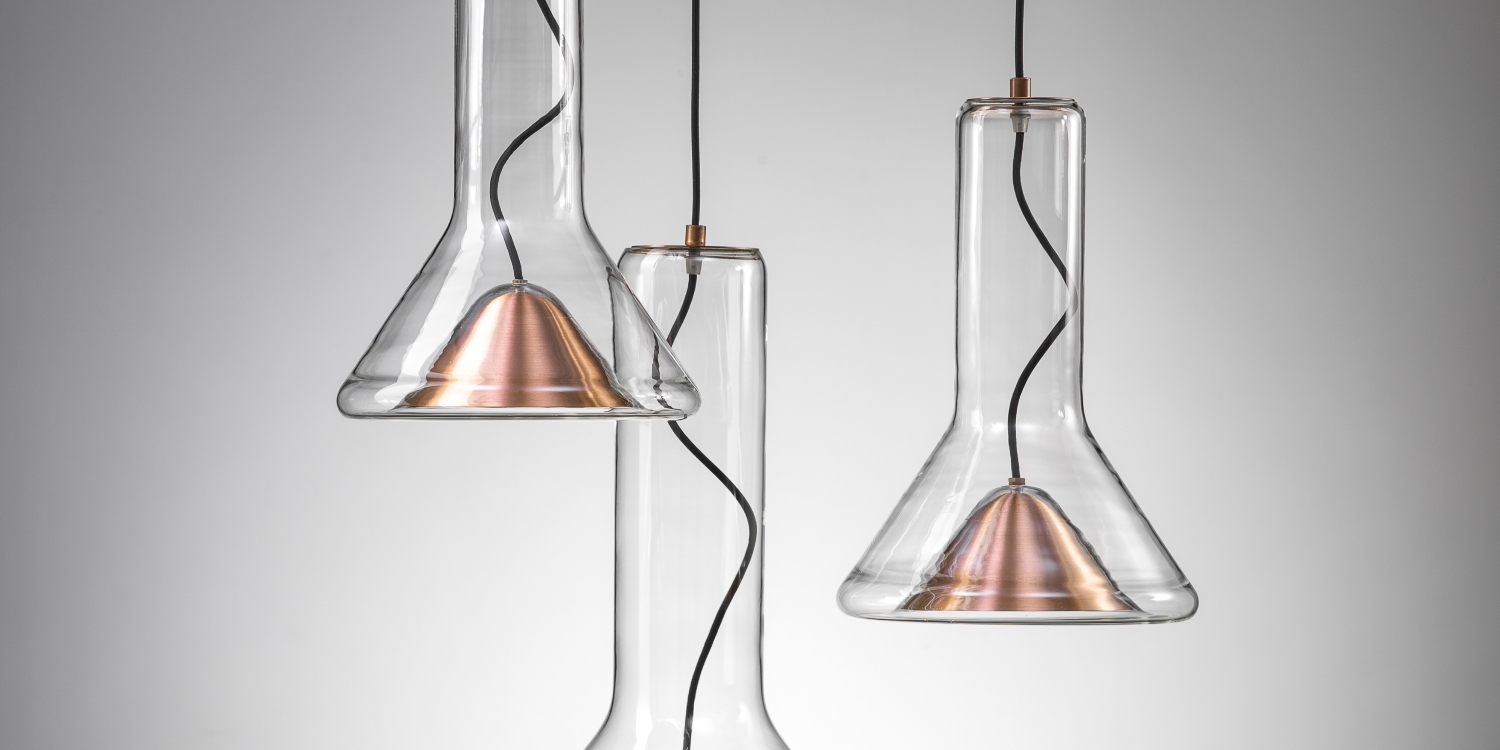 Brokis Whistle Set SSM lights with sculptural glass flasks and metal cones, on elegant black cords.