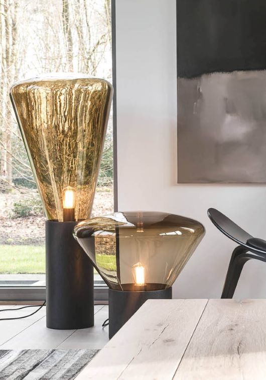 Brokis Muffins Wood 04 and 02 floor lamps with handblown brown glass shades grace a luxurious window-side tableau.