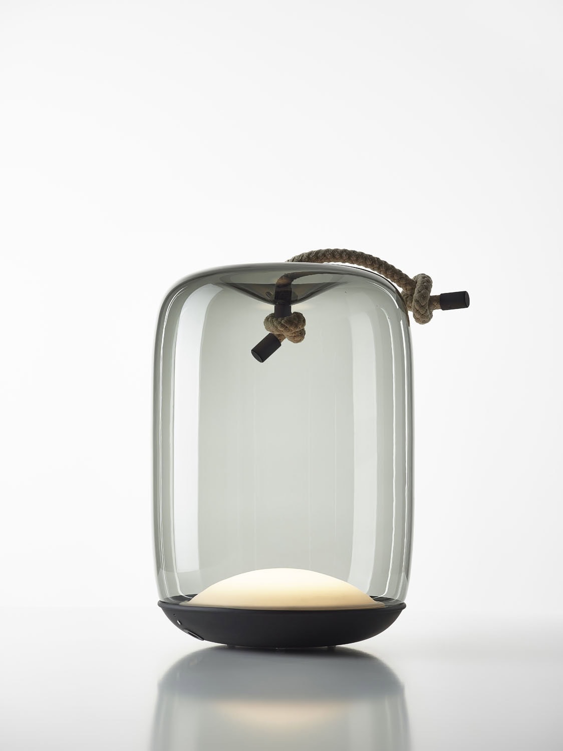 Brokis Knot Cilindro Table Battery Lamp pairs a smoky handblown glass dome and rope handle for a sculptural statement glow.