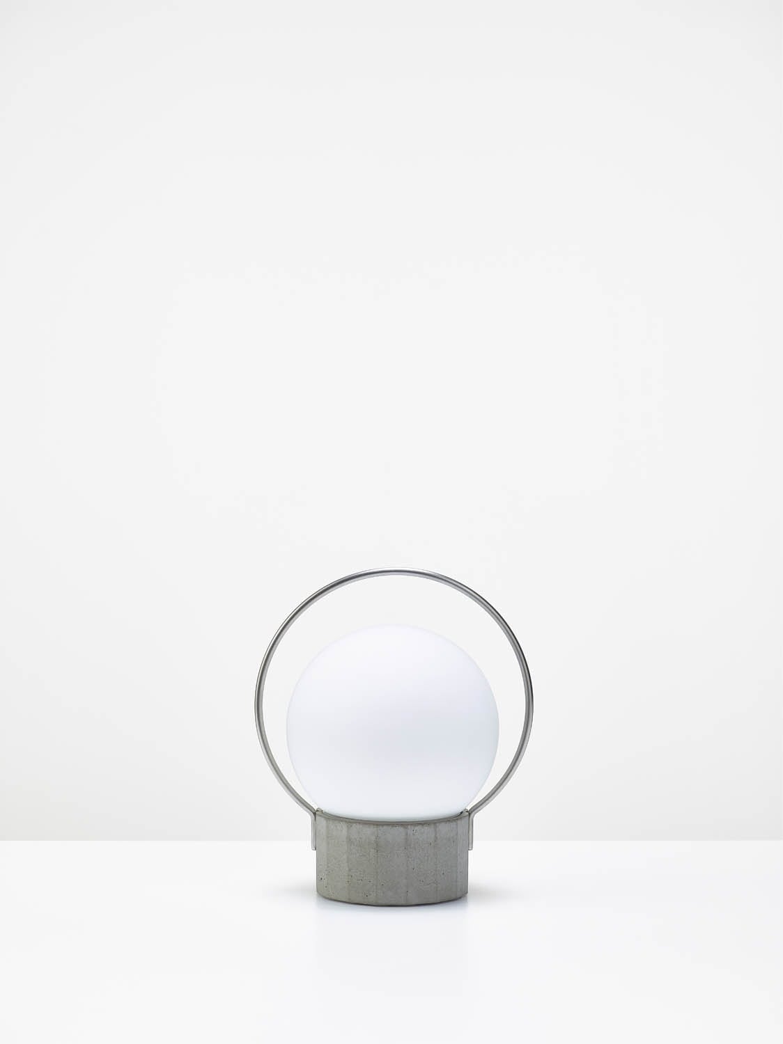 Brokis Sfera Portable Small: handblown glass globe, sculptural grey concrete base, metallic ring; minimalist elegance.