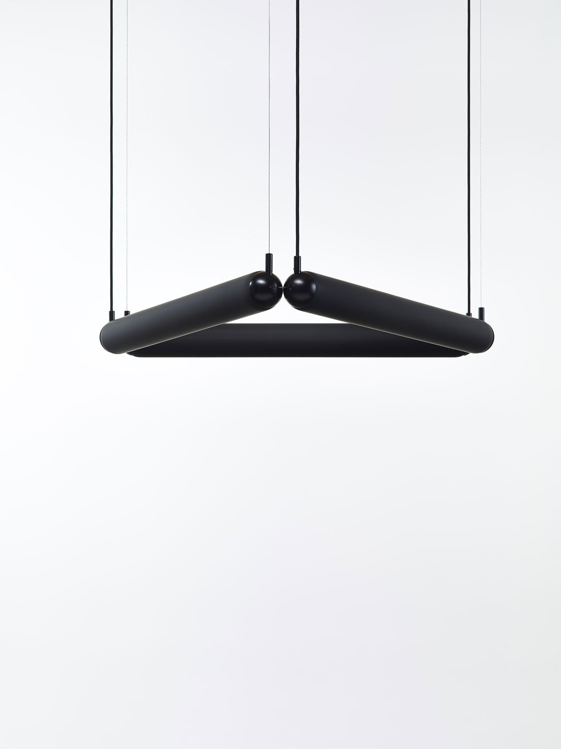 Brokis Puro Contour Triangle 600 is a minimalist black chandelier, three sculptural arms forming a striking geometric design.