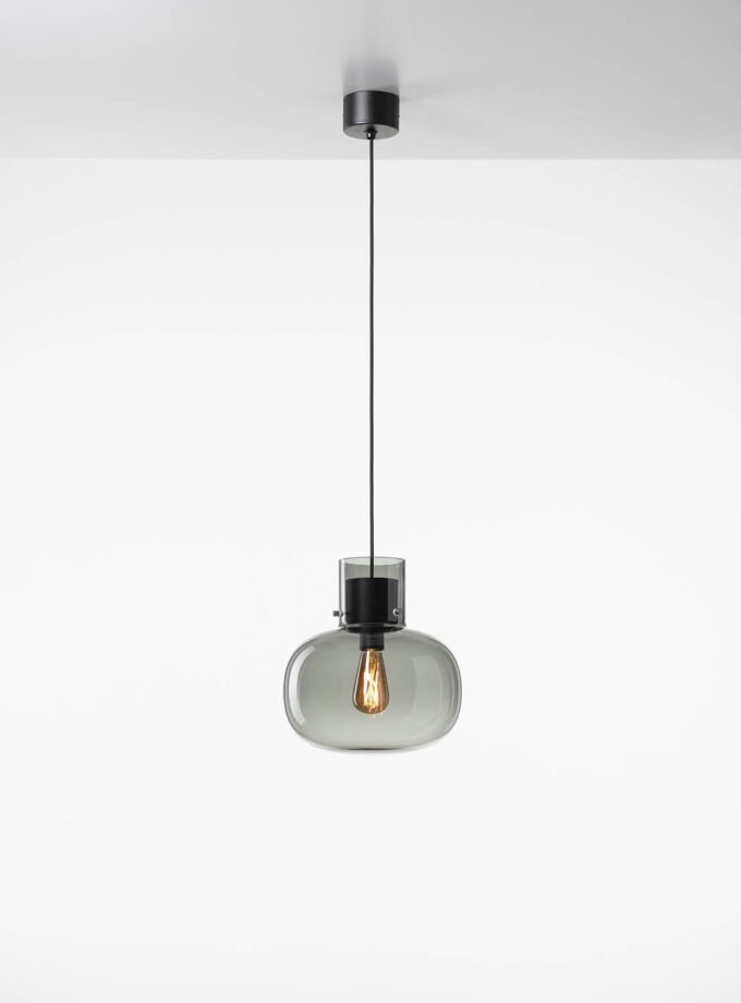 Brokis Awa Medium Pendant showcases handblown smoke grey glass and an exposed bulb, suspended elegantly from a white ceiling.