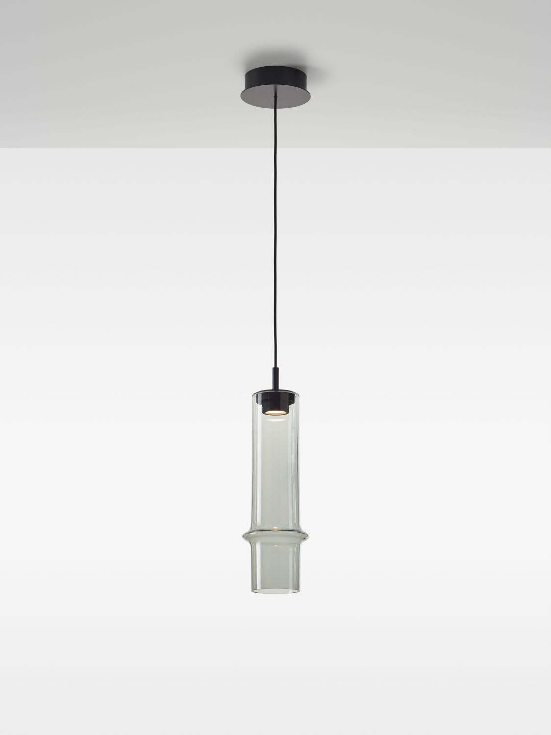 Brokis Bamboo Forest M pendant suspends elegantly, featuring a handblown smoke grey shade with a gentle central bulge.