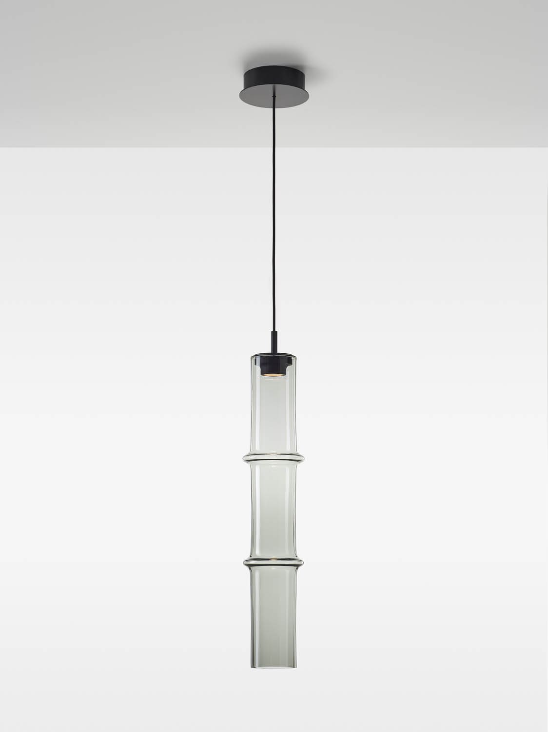 Brokis Bamboo Forest XL Double Pendant: handblown glass, sculptural triple-section shade, black flex, white background.
