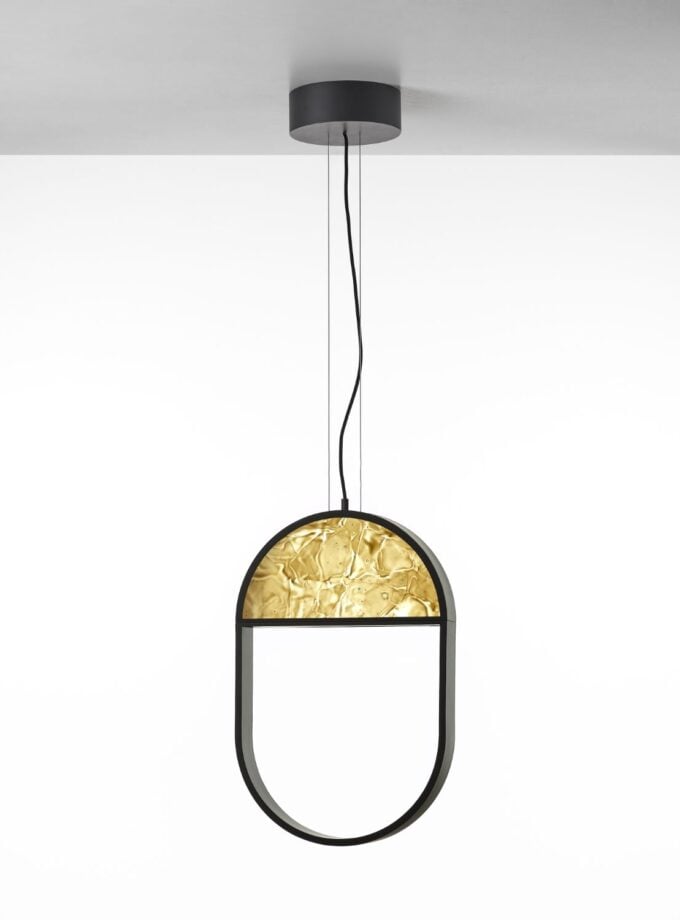 Brokis Geometric Oval 1/3 Top Pendant features a black frame and amber BROKISGLASS, suspended in elegance.