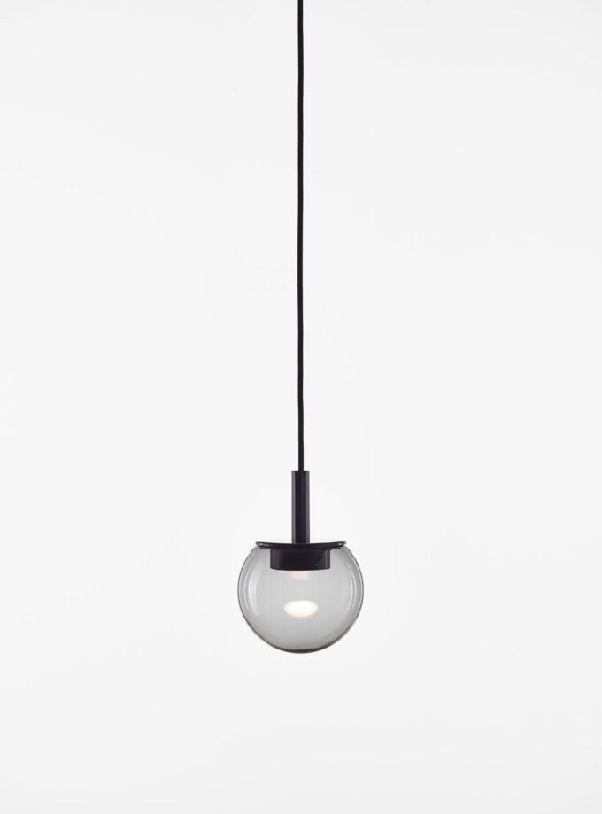 Brokis Orbis 150 Pendant, with hand-blown glass sphere, floats on a slender black cord and glows elegantly against white.