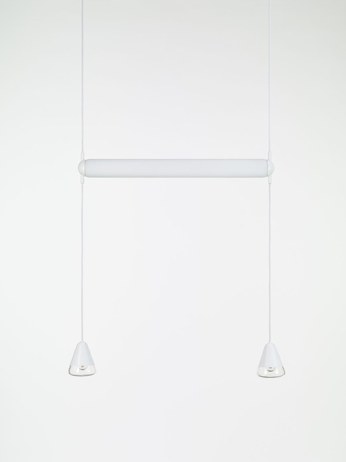 Brokis Puro Single Horizontal 800 Pendant: hand-blown glass tube, sleek flexes, conical glass shades, pure white backdrop.