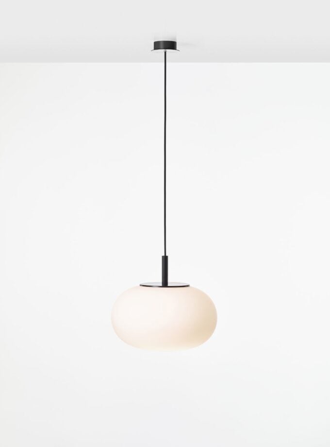 Brokis Sfera Oval 380 Pendant features a sculptural, handblown frosted glass shade on a sleek black flex against white.
