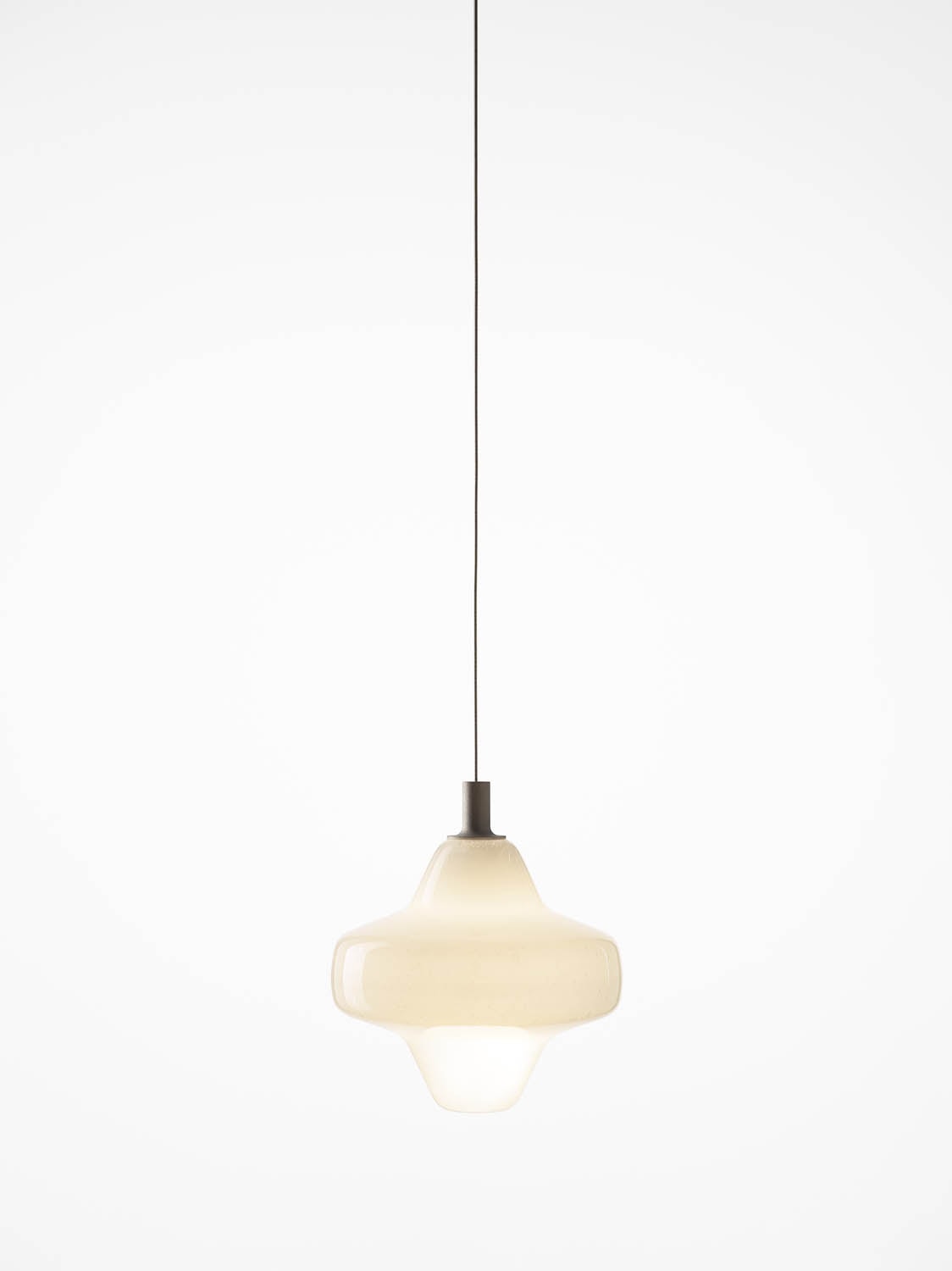 Brokis Starcloud Lyra Pendant in handblown, opaline glass floats on a slender black cord, casting a soft, sculptural glow.