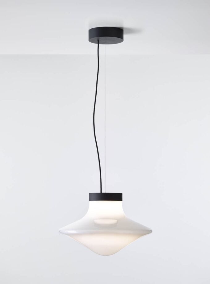 Brokis Trottola Pendant L features a sculptural opaline glass shade, casting a luxurious glow from the ceiling.