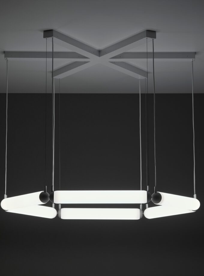 Brokis Puro Contour Hexagon 600 Chandelier stuns with sculptural LED tubes in a handblown hexagonal silhouette.