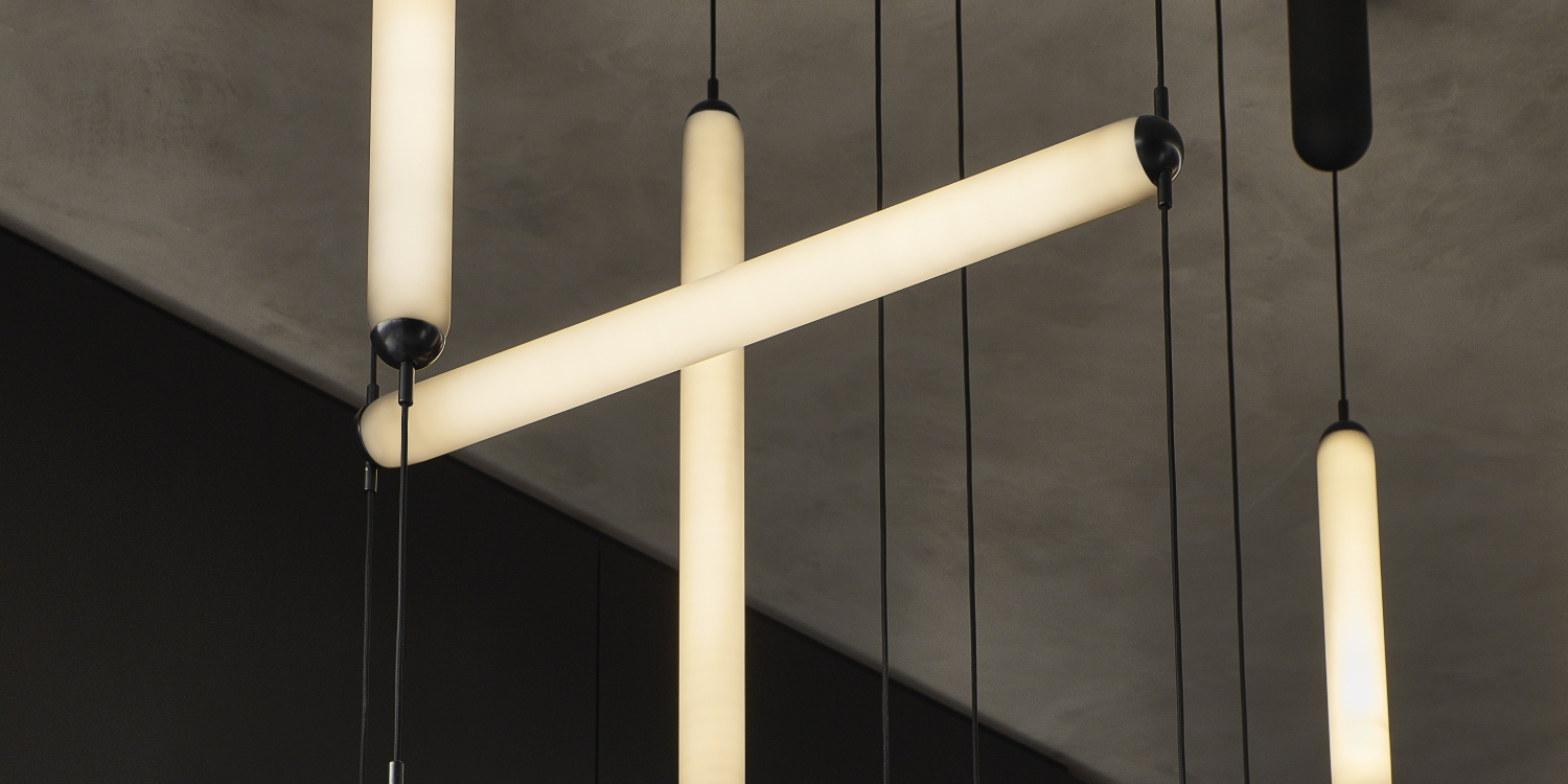 Brokis Puro pendants showcases hand-blown glass forms, casting luxe, warm illumination.