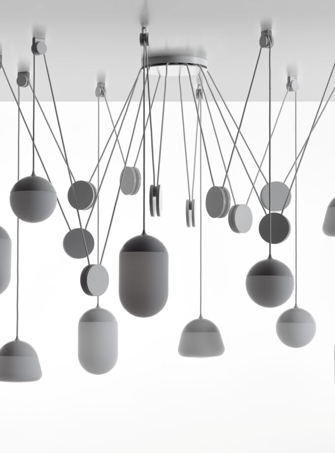 Brokis Planets 10 Set displays sculptural, handblown lights with matte white shades and slender cords in a luxe array.