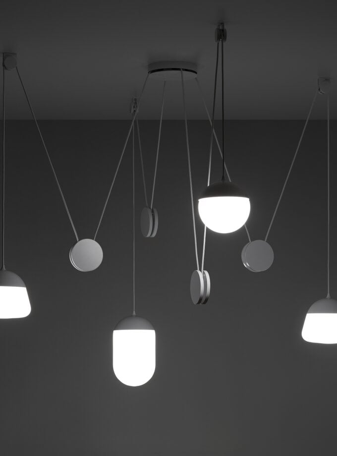 Brokis Planets 4 Set in sculptural white glass cascade elegantly, casting a luxe glow from slender cords.