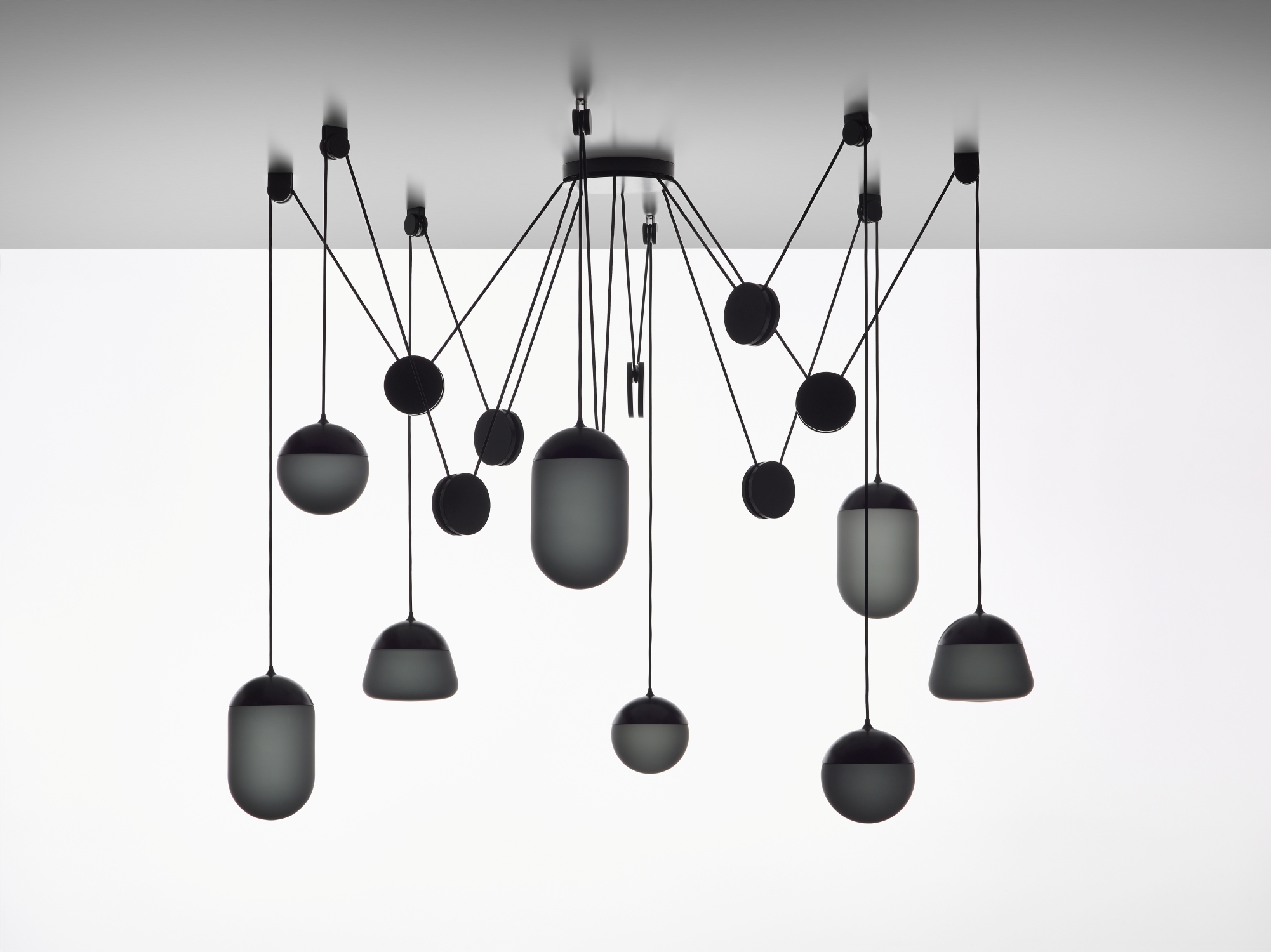 Brokis Planets 8 Set features sculptural black lights with handblown matt shades for a striking ceiling display.