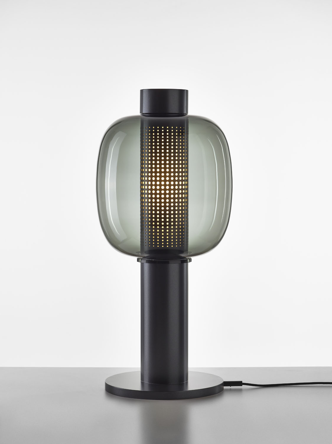 Brokis Bonbori Large lamp features a sculptural black base and handblown smoky glass shade, exuding contemporary luxury.