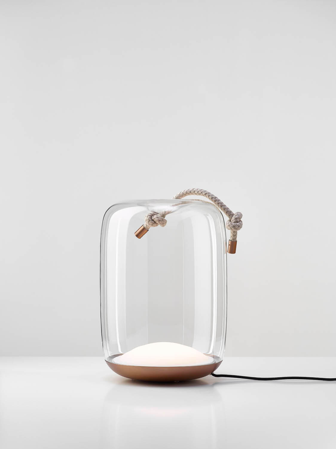 Brokis Knot Cilindro Table lamp dazzles with handblown crystal, a bronze base, and knotted rope, radiating soft white light.
