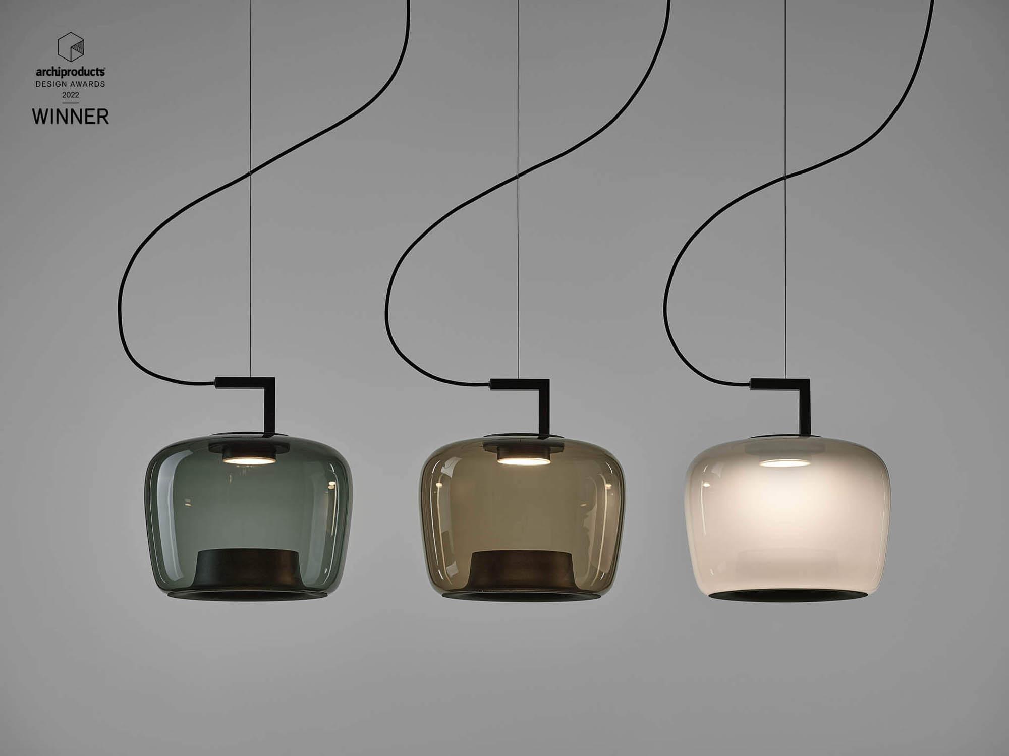 Brokis Double pendant lights in handblown green, brown, and white glass gleam in a row, exuding refined luxury.