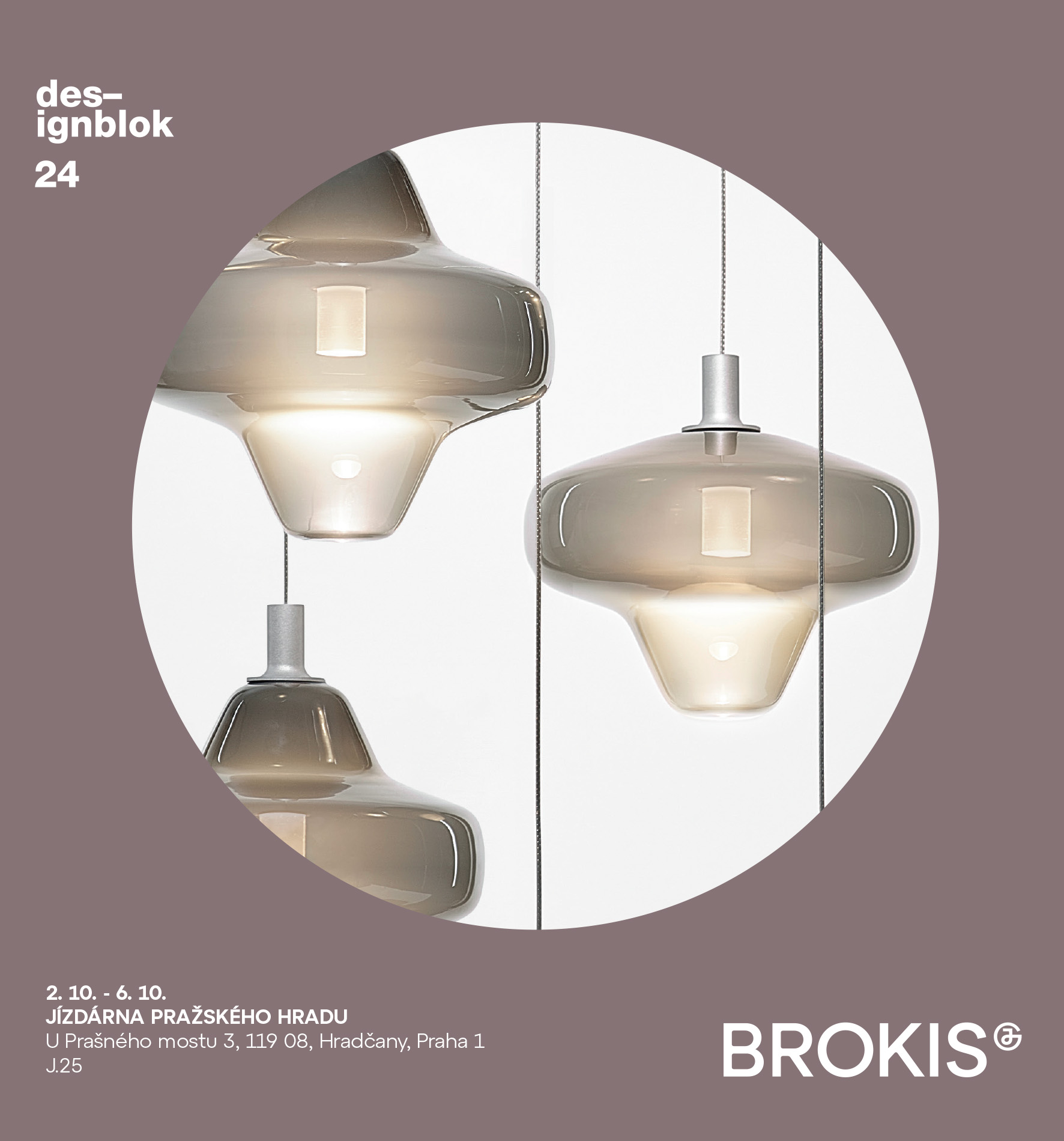 Handblown Brokis Starcloud pendant lamps in smoke grey and clear tones glow luxuriously against a pale backdrop.