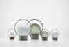 Brokis Sfera Portable lamps with crystal globes on multicoloured bases, artfully arranged on a pristine white surface.