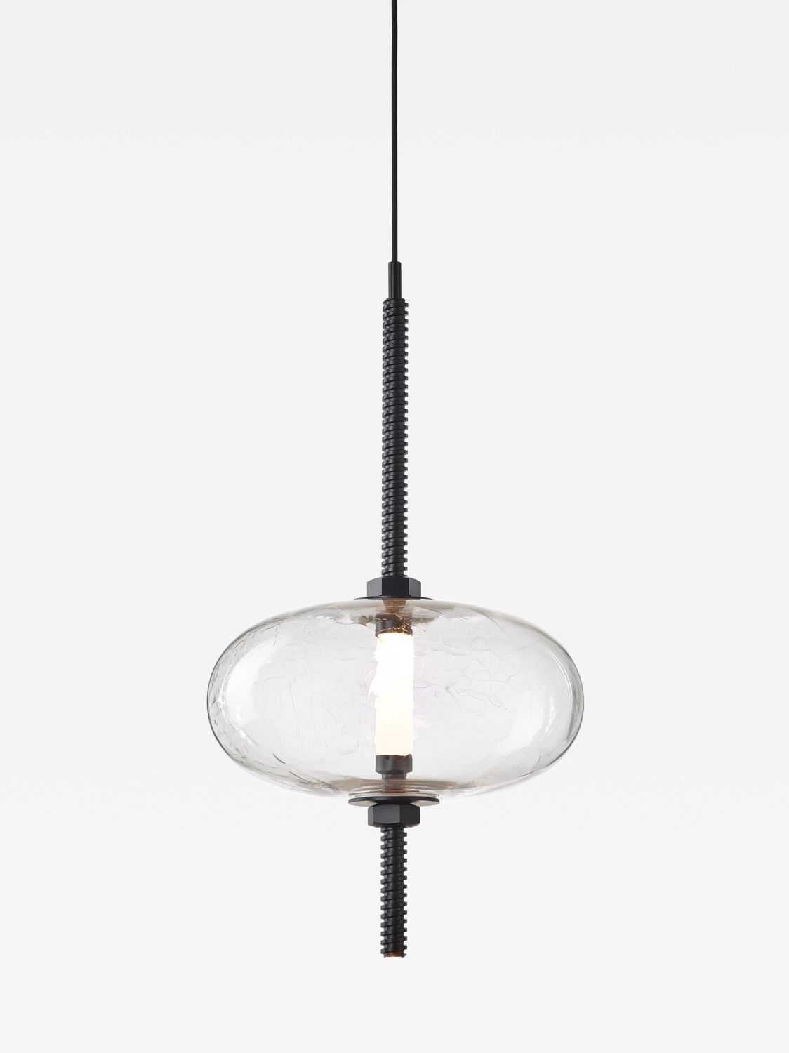 Brokis Under Pressure Vertical Most Pendant: sculptural glass, vertical LED, black metal accents, suspended on black flex.