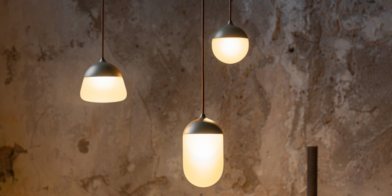 Brokis Planets MINI 3 Set with frosted glass shades radiate a soft, sculptural glow in a luxe minimalist space.