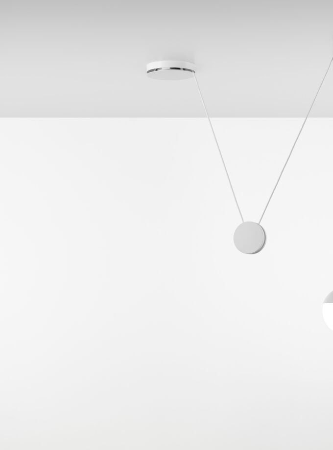 Brokis Planets 1 Set on a minimal white ceiling with geometric suspended elements.