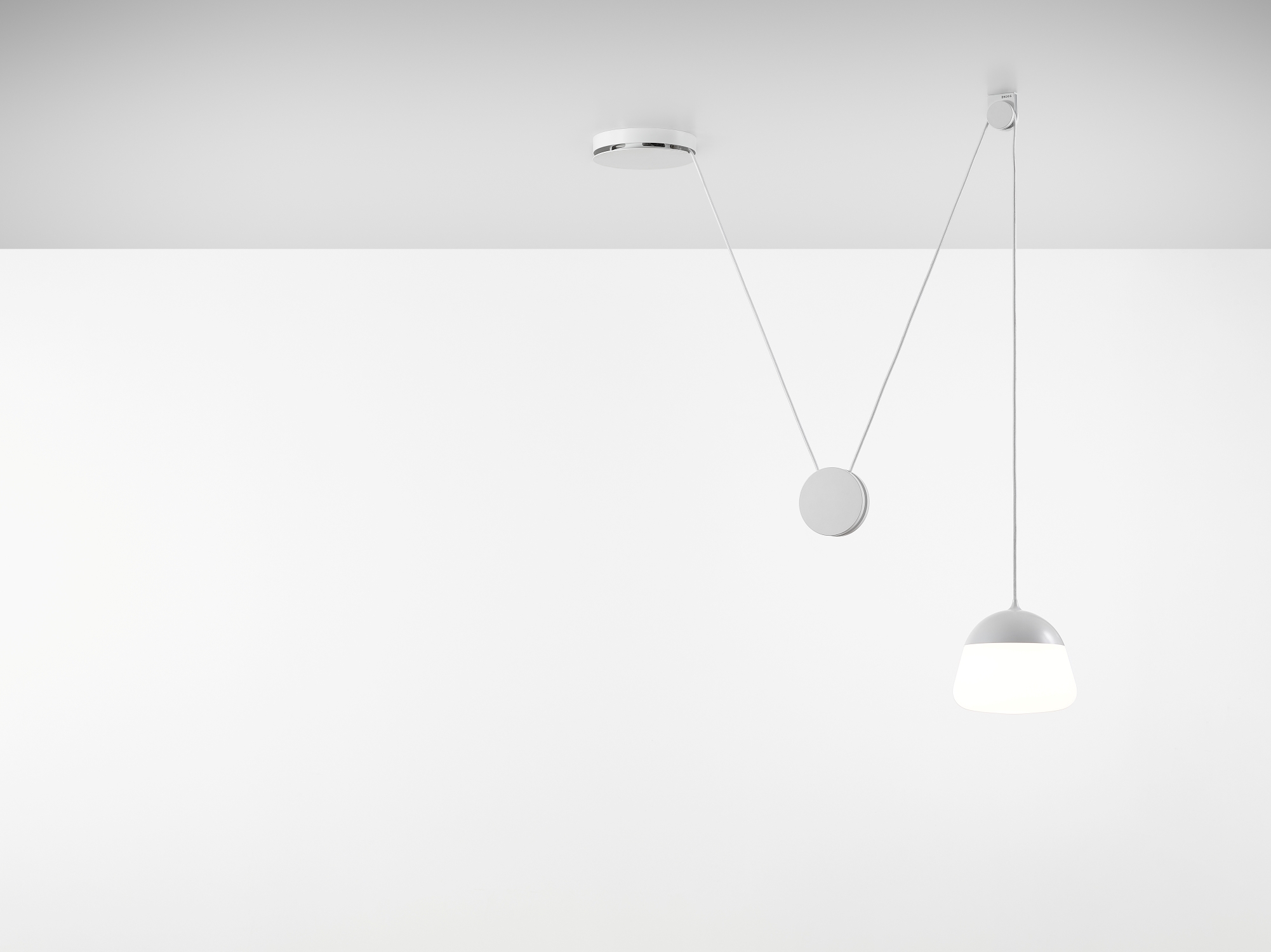 Brokis Planets 1 Set in a pristine white room exudes elegance with a soft glow illuminating the space.