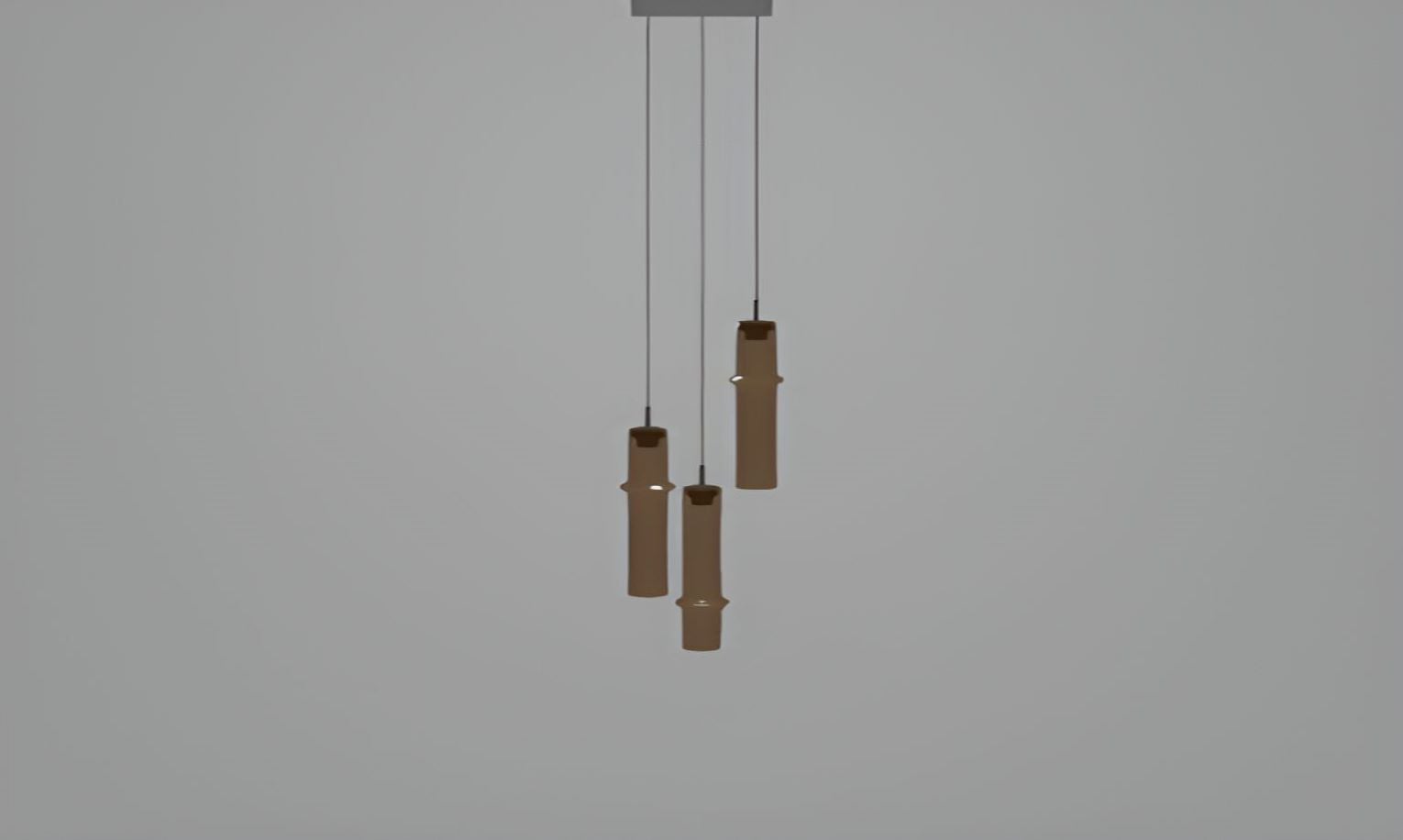 Sculptural Brokis Bamboo Forest C3B pendant lights in natural bamboo hang artfully at varying heights against a pale grey backdrop.