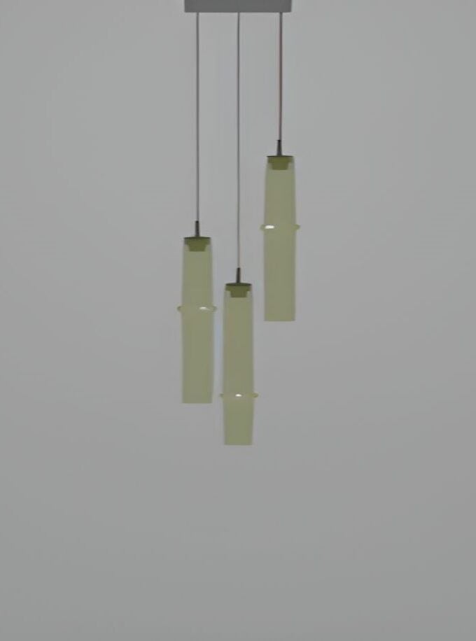 Brokis Bamboo Forest C3C handblown crystal pendants glow in frosted green-yellow, suspended at artful heights on a pale backdrop.