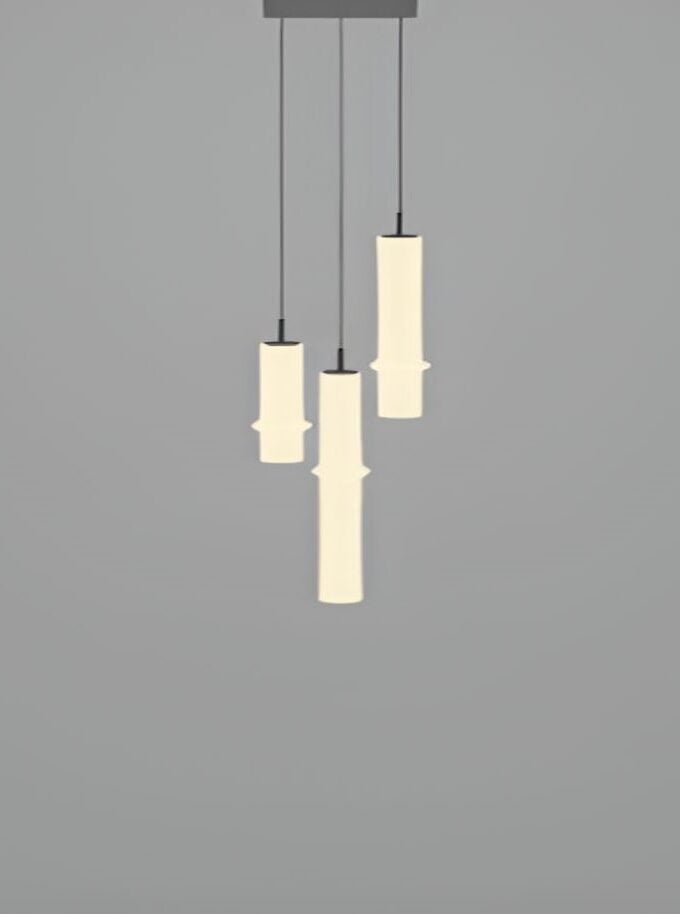 Brokis Bamboo Forest C3D: sculptural pendant with four cylindrical shades, handblown glass, emitting a warm, elegant glow.