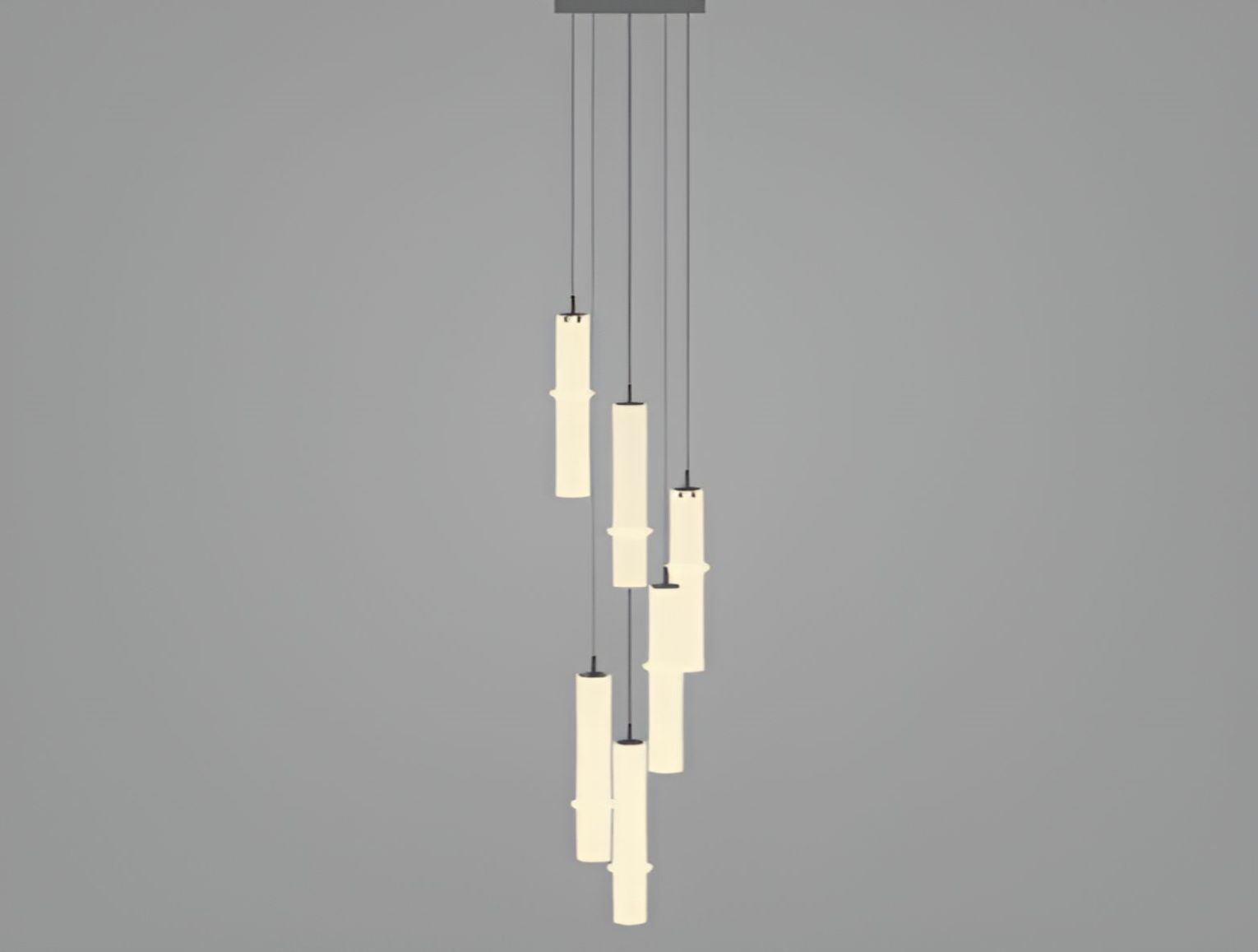 Brokis Bamboo Forest C6C chandelier: seven handblown, candle-like cylinders cascade elegantly, casting a warm, sculptural glow.