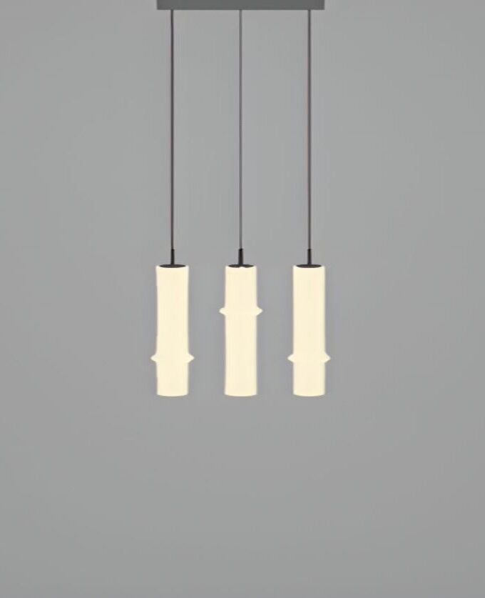 The Bamboo Forest R3A by Brokis: three sculptural, cream-hued glass pendants in a minimalist row on slim black flexes.