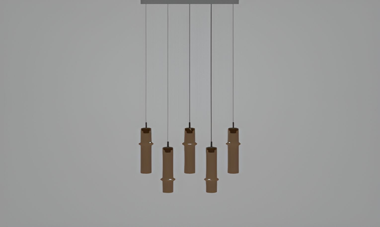 Brokis Bamboo Forest R5C ceiling light: six sculptural brown pendants in handblown glass, suspended at varying heights.