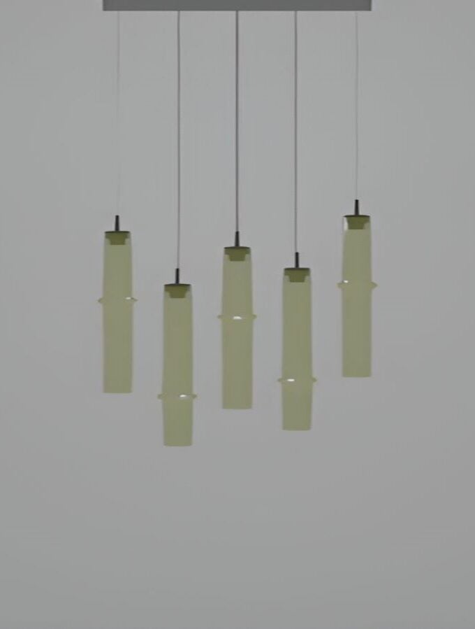 Brokis Bamboo Forest R5D pendants in soft green-yellow glass, hand-blown and sculptural, glow luxuriously in staggered heights.