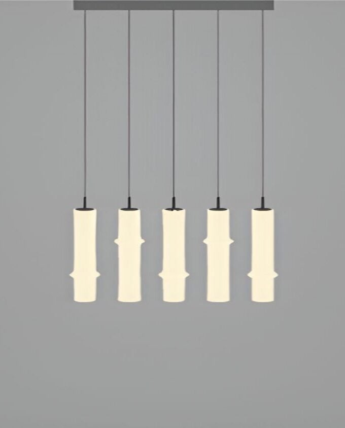 Brokis Bamboo Forest R5A pendant lights evoke sculptural crystal bamboo, suspended in a luxurious row with a warm glow.