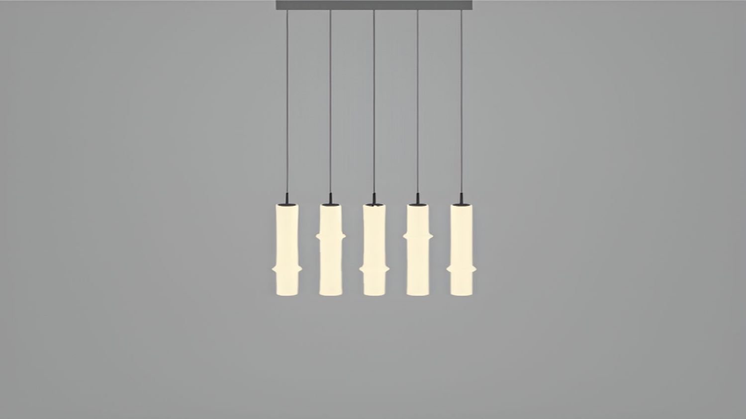 Brokis Bamboo Forest R5A pendant lights evoke sculptural crystal bamboo, suspended in a luxurious row with a warm glow.