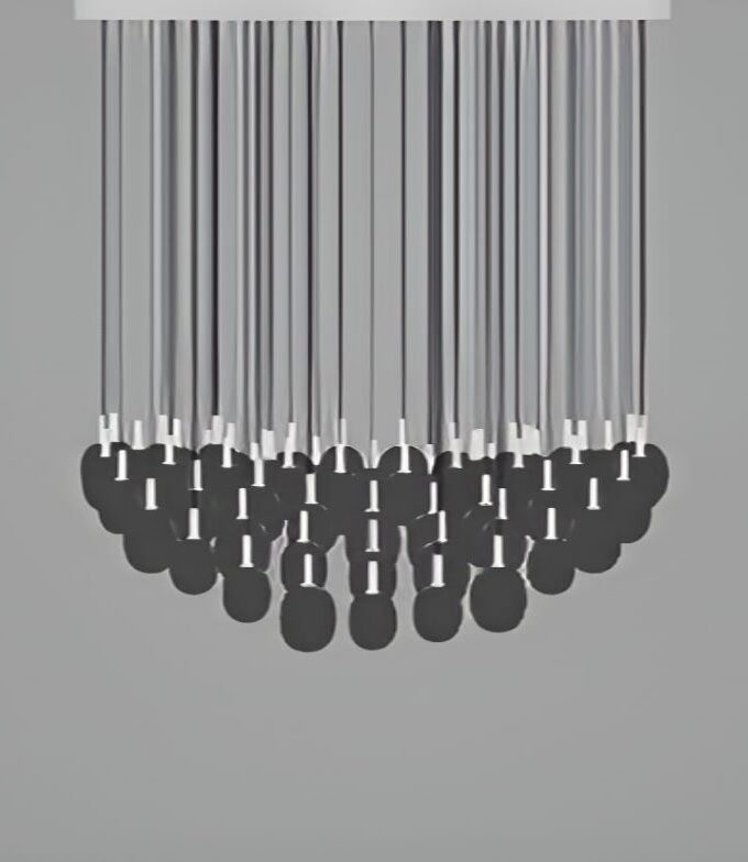 A semicircle of sleek black pendulums hang from thin rods with white-tipped joints, elegantly spaced on a plain grey backdrop.